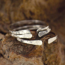 Load image into Gallery viewer, Handmade Sterling Silver Adjustable Hammered Ring. Hammered details add a faceted and shimmering finish. This ring is easily adjustable by opening or closing the gap. Quality handmade jewelry. Stacking rings. BOHO ring. Adjustable Rings. Bohemian style. Handmade jewelry. The Gypsy Collection - Lucky Birds Boutique