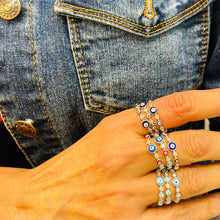 Load image into Gallery viewer, Evil Eye 🧿 dark blue iris with sterling silver band rings stacked on model: Ward Off Evil from your life with this easy to wear Evil Eye Ring. The eye protects it’s wearer from jealousy, bad luck and ill wishes from others. Jewelry gift. Boho Jewelry. Evil eye ring. Evil eye jewelry. The Gypsy Collection - Lucky Birds Boutique