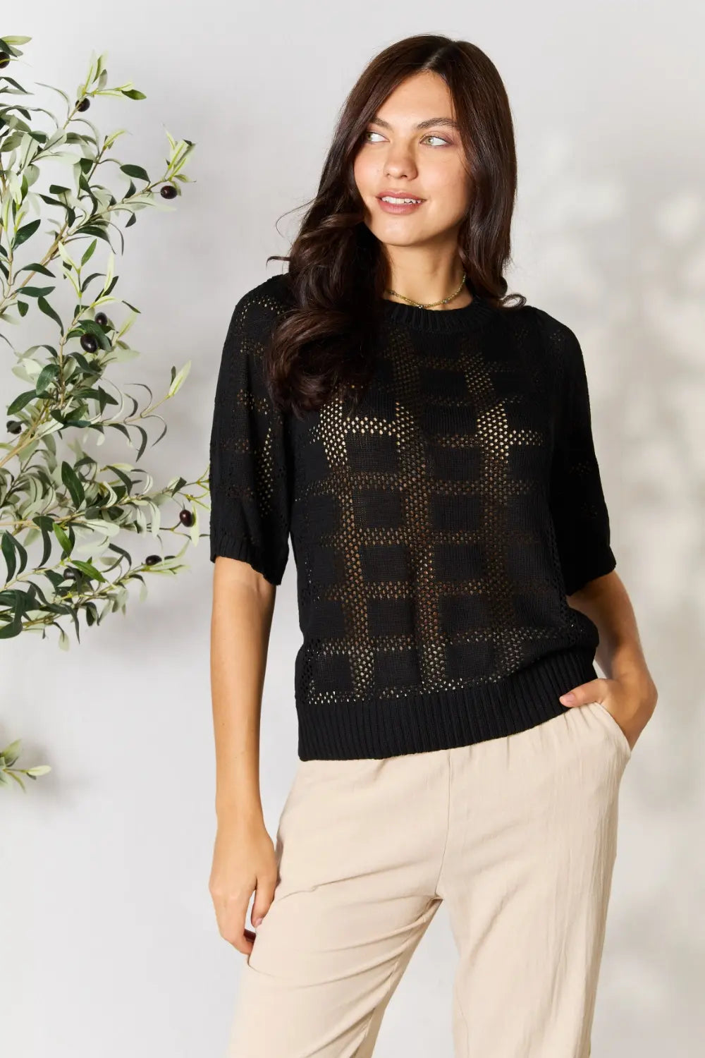Women's ribbed knit half sleeve top with round neckline with sheer style. Features a see-through design with solid rectangular fabric detailing. Allows visibility of bralette. On model front view - Valerie Collection Mandy top