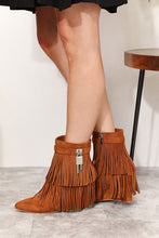 Load image into Gallery viewer, Women&#39;s western wedge ankle booties with side tassels in faux suede on model. Side view of wedge botties- Jolene Collection &#39;Legend&#39; boots.
