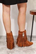Load image into Gallery viewer, Women&#39;s western wedge ankle booties with side tassels in faux suede on model. Rear view of tassels and lock embellishment - Jolene Collection &#39;Legend&#39; boots.
