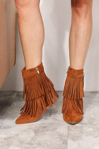 Women's western wedge ankle booties with side tassels in faux suede on model - Jolene Collection 'Legend' boots.