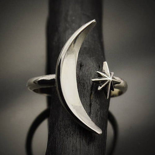 Take the drama of the night sky wherever you go when you wear this adjustable moon and star ring. A graceful ring is ultra-feminine and sleek. A comfortable design that's a true delight to wear! Sterling Silver ring for women. Sterling Silver Jewelry. The Valerie Collection - Lucky birds Boutique