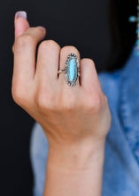 Load image into Gallery viewer, Burnished silver Navajo inspired ring with turquoise stone on model. Perfect addition to western jewelry set or part of your BOHO ring collection. Turquoise ring. Western rings for women. Bohemian ring. The Jolene Collection - Lucky Birds Boutique
