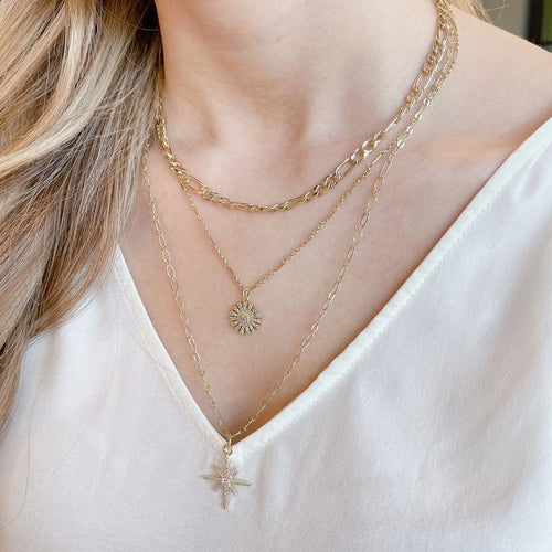Chic Triple chain necklace. 18K gold plated layered necklace. North star pendant and crystal flower pendant - on model. Lucky Birds necklaces for women. Lolita Collection. 
