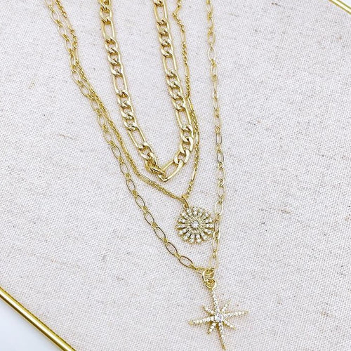 Triple chain necklace. 18K gold plated layered necklace. North star pendant and crystal flower pendant - Close Up. Lucky Birds necklaces for women. Lolita Collection. 