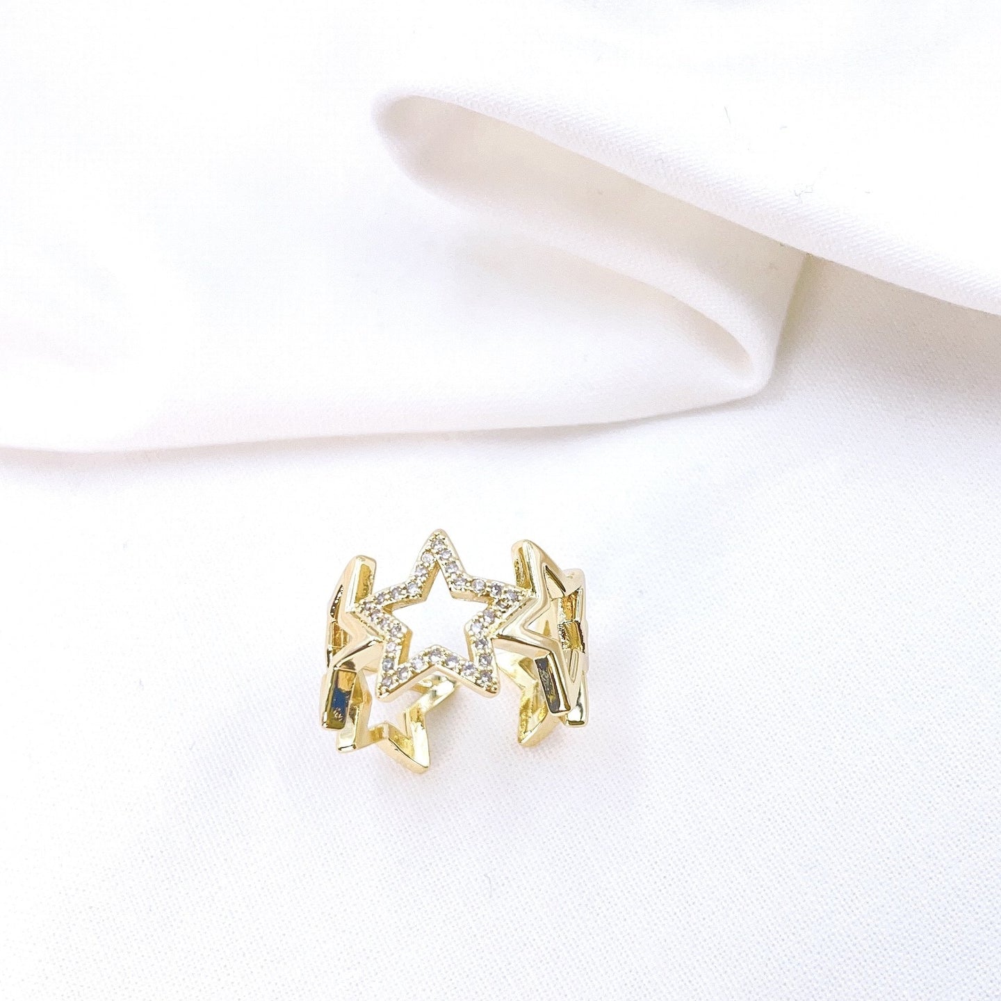 Adjustable Cut out Star Ring. Gold plated ring. Center star adorned with CZ crystals. Lucky Birds - The Valerie Collection. 