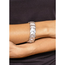 Load image into Gallery viewer, Burnished silver crescent stretch bracelet on model. Simple and beautiful design this silver bracelet is easily worn solo. Western bracelet. Silver jewelry. Women&#39;s accessories. Top selling bracelet. The Jolene Collection - Lucky Birds Boutique

